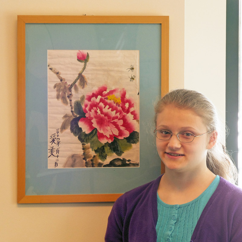 Abigail Ham with her Chinese flower painting (photo by Harmon Clark) 