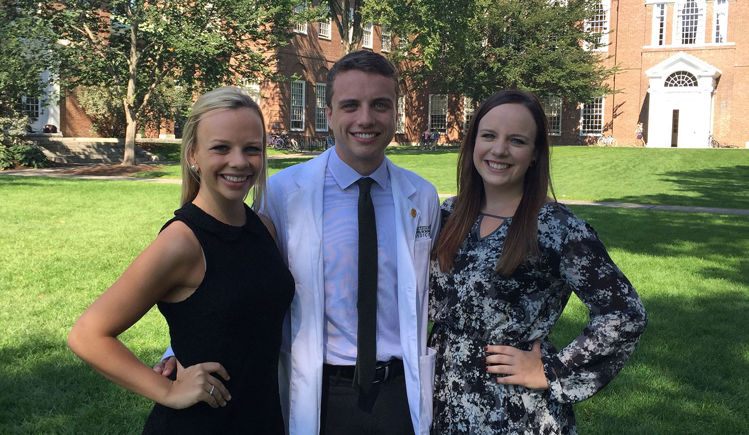 Kevin Doré '19 with his sisters Maura (left) and Kelly (right) after Geisel's White Coat Ceremony.