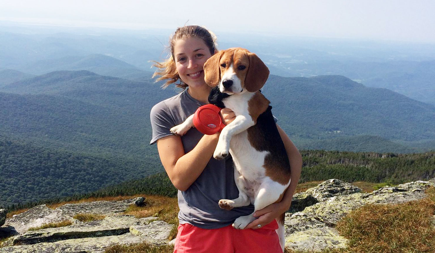 Catherine Gordon with her dog, Moby, at the summit of Camel's Hump in Vermont.