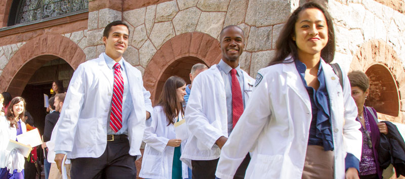 Geisel Students walking in White Coats